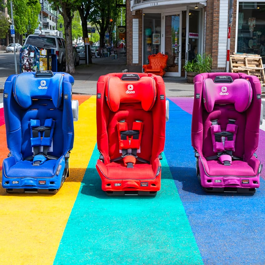 Three Diono convertible car seats in blue, red and pink